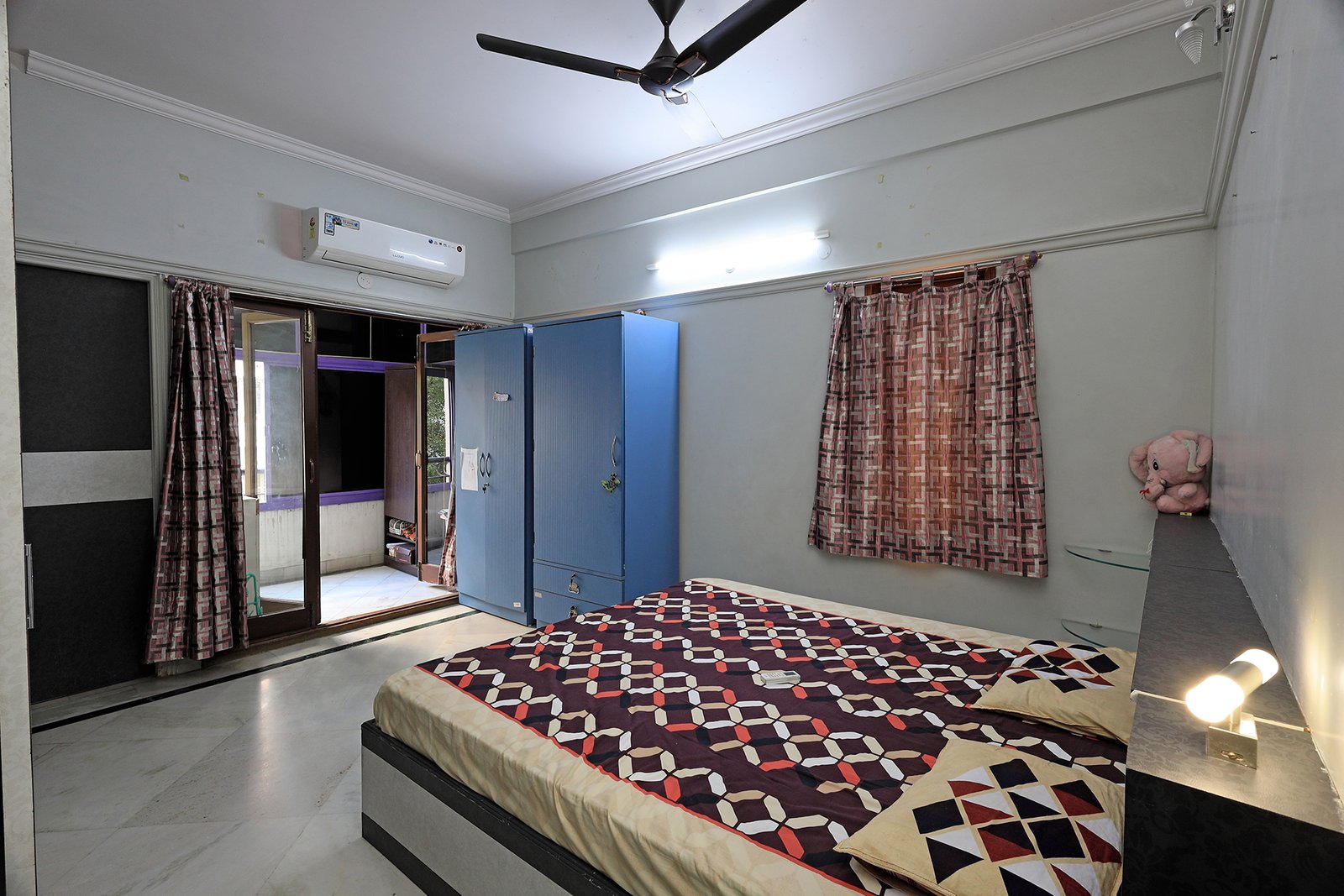 Bedroom 2 with the attached balcony and large sliding windows