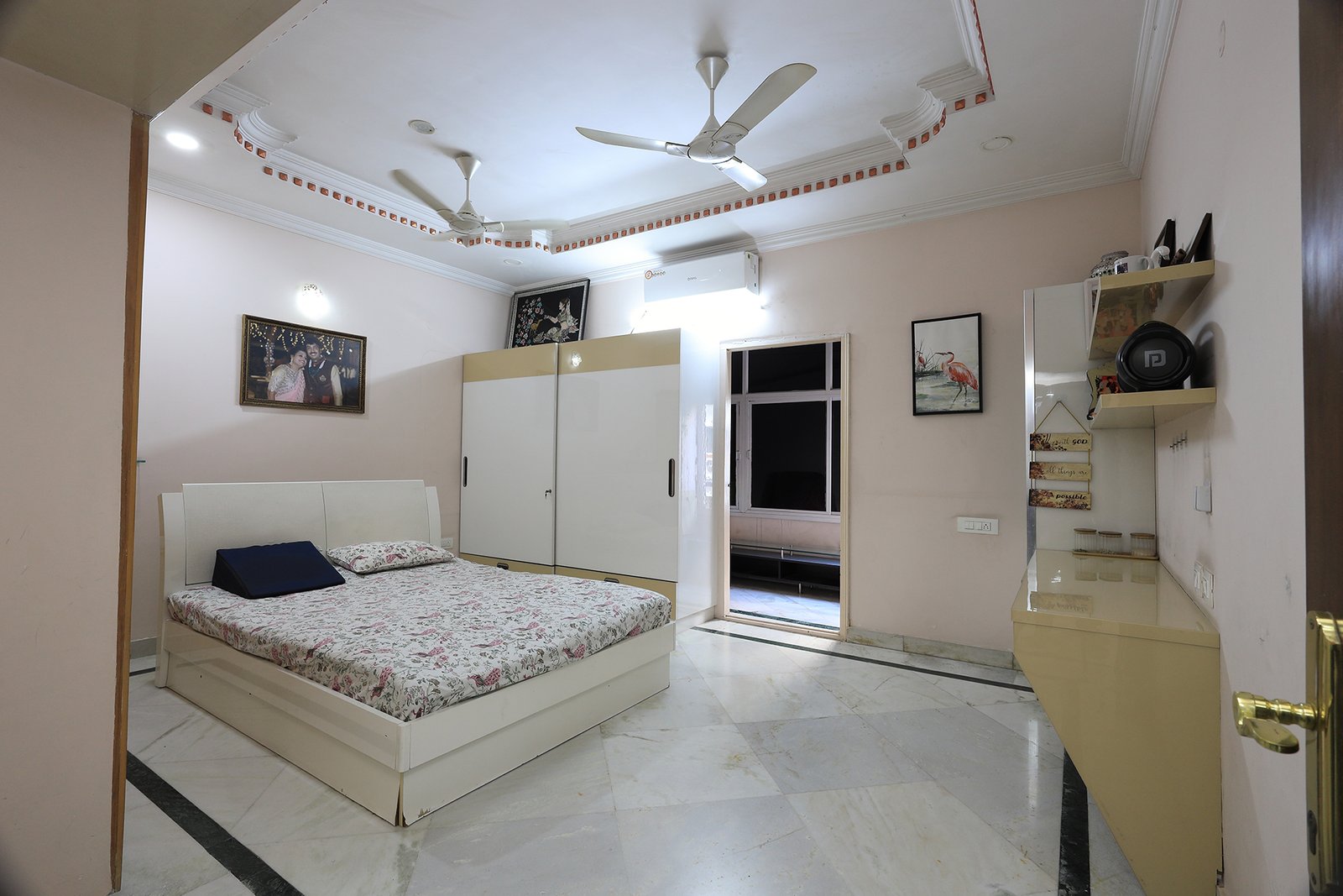 Master bedroom with a second wardrobe and door to the attached balcony